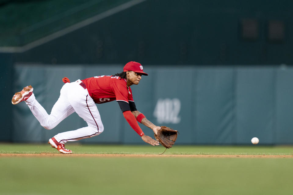 Washington Nationals shortstop CJ Abrams fields a ground ball hit in by Atlanta Braves' Orlando Arcia for an out during the second inning of the second game of a baseball doubleheader, Sunday, Sept. 24, 2023, in Washington. (AP Photo/Stephanie Scarbrough)