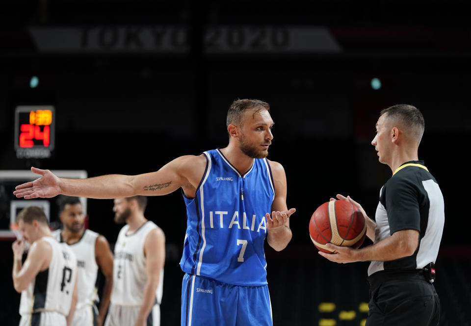 Italy's Stefano Tonut (7) questions a foul call during men's basketball preliminary round game against Germany at the 2020 Summer Olympics, Sunday, July 25, 2021, in Saitama, Japan. (AP Photo/Charlie Neibergall)