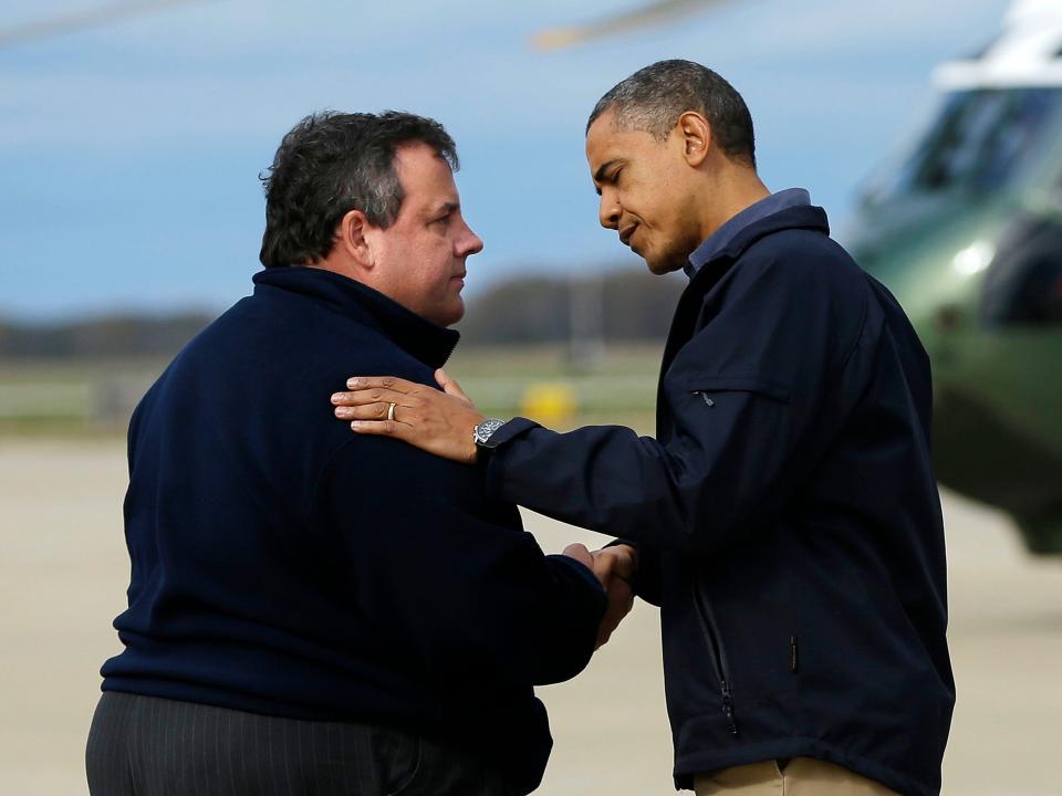 FILE - In this Oct. 31, 2012 file photo, President Barack Obama is greeted by New Jersey Gov. Chris Christie upon his arrival at Atlantic City International Airport, in Atlantic City, N.J. Obama traveled to region to take an aerial tour of the Atlantic Coast in New Jersey in areas damaged by superstorm Sandy. Ever since President George W. Bush's administration was crippled by its response to Hurricane Katrina, politicians and news organizations have been acutely aware of the stakes raised by big storms.