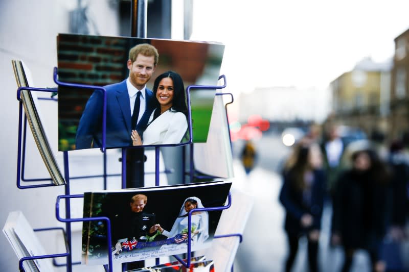 Merchandise depicting Britain's Prince Harry and Meghan, Duchess of Sussex, are seen on display in a souvenir shop near Buckingham Palace in London