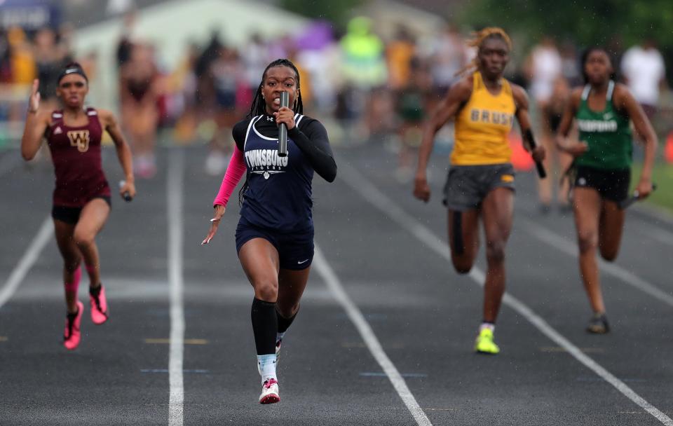 Twinsburg's Paris Gosha-Foreman leads the pack in the girls 400-meter relay race during the Division I regional track and field meet at Austintown Fitch High School on Friday.