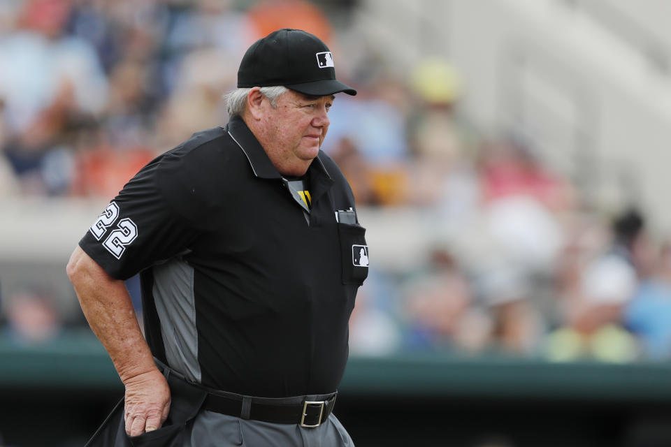 Umpire Joe West is seen during a spring training baseball game between the Detroit Tigers and the Pittsburgh Pirates, Tuesday, March 10, 2020, in Lakeland, Fla. (AP Photo/Carlos Osorio)