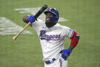 Texas Rangers' Adolis Garcia walks to home plate to bat against the Oakland Athletics in the third inning of a baseball game Thursday, June 24, 2021, in Arlington, Texas. (AP Photo/Louis DeLuca)