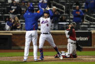 New York Mets' Joey Lucchesi and third baseman Jeff McNeil (6) celebrate after scoring on McNeil's home run against the Arizona Diamondbacks during the third inning of a baseball game Saturday, May 8, 2021, in New York. (AP Photo/Noah K. Murray)