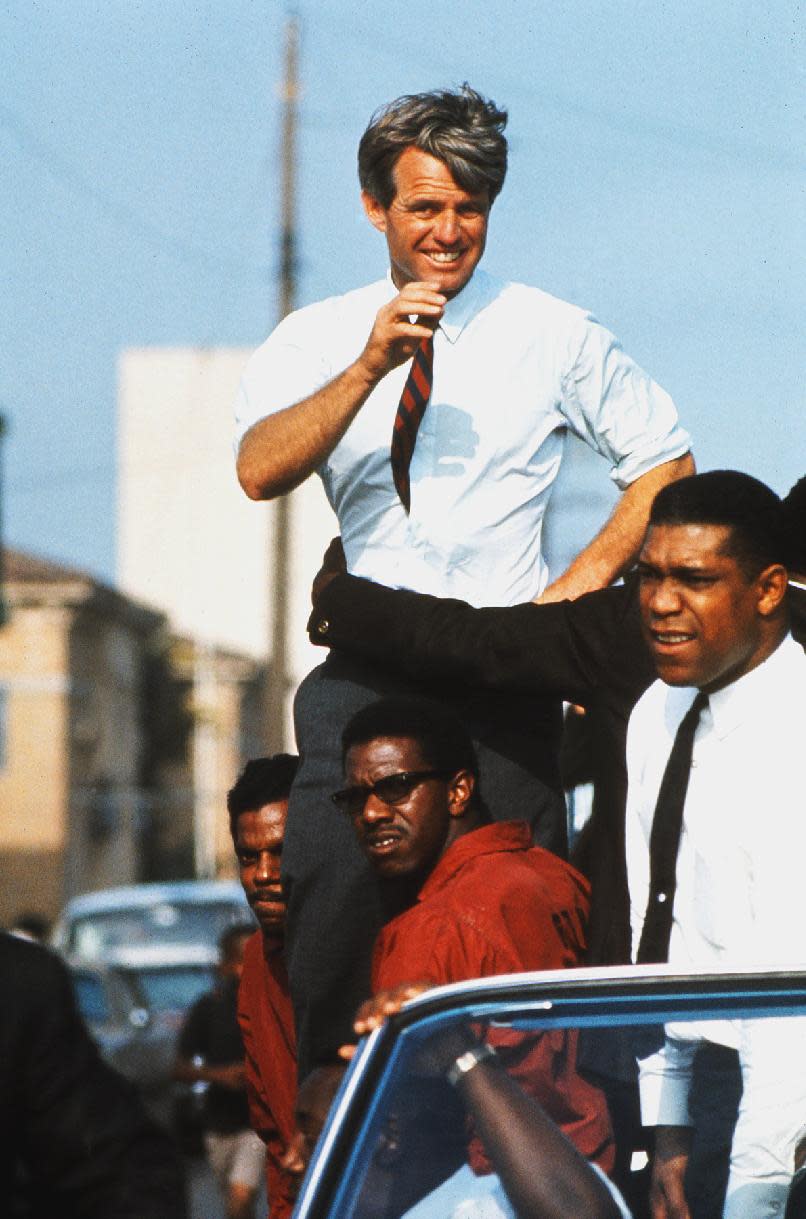 This June 1968 photo taken by Bill Eppridge and released courtesy of Monroe Gallery shows presidential hopeful Robert F. Kennedy campaigning in the Watts section of Los Angeles. Photojournalist Bill Eppridge, whose legendary career included capturing images of a mortally wounded Robert Kennedy, the Beatles and the civil rights movement, died, Thursday, Oct. 3, 2013 in Danbury, Conn., after a brief illness. He was 75. (AP Photo/Monroe Gallery, Bill Eppridge)