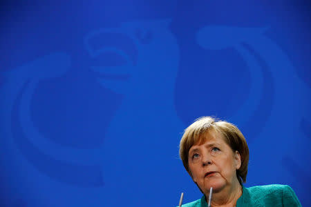 German Chancellor Angela Merkel talks during a news conference with Austria's Chancellor Sebastian Kurz at the Chancellery in Berlin, Germany, January 17, 2018. REUTERS/Fabrizio Bensch