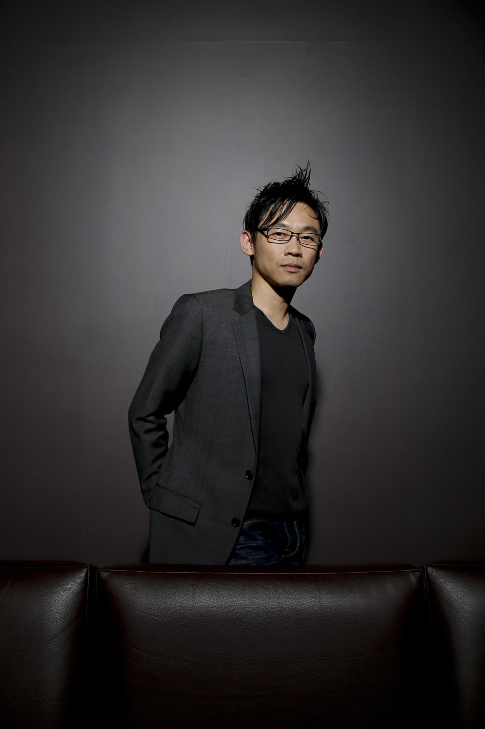 In this Monday, June 17, 2013 photo, Malaysian-Australian director James Wan poses for photos at the Paramount Pictures Studios in Los Angeles. Wan has been splitting his days this summer between pre-production on the seventh "Fast & Furious" film and putting the finishing touches on his indie scare-fest "Insidious 2," due in September. (AP Photo/Jae C. Hong)