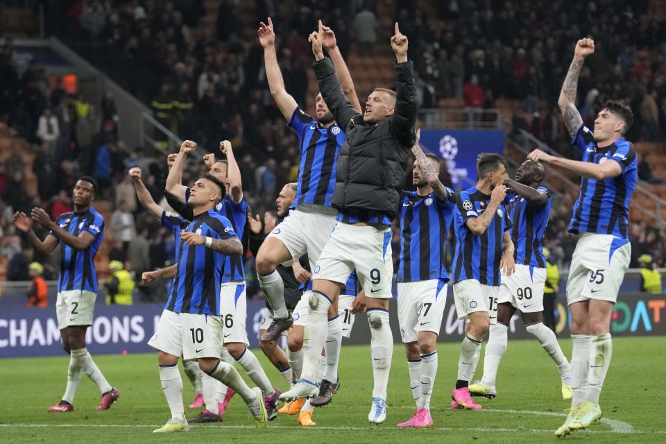 Inter Milan's Edin Dzeko, center, celebrates with team mates after the Champions League semifinal first leg soccer match between AC Milan and Inter Milan at the San Siro stadium in Milan, Italy, Wednesday, May 10, 2023. (AP Photo/Luca Bruno)