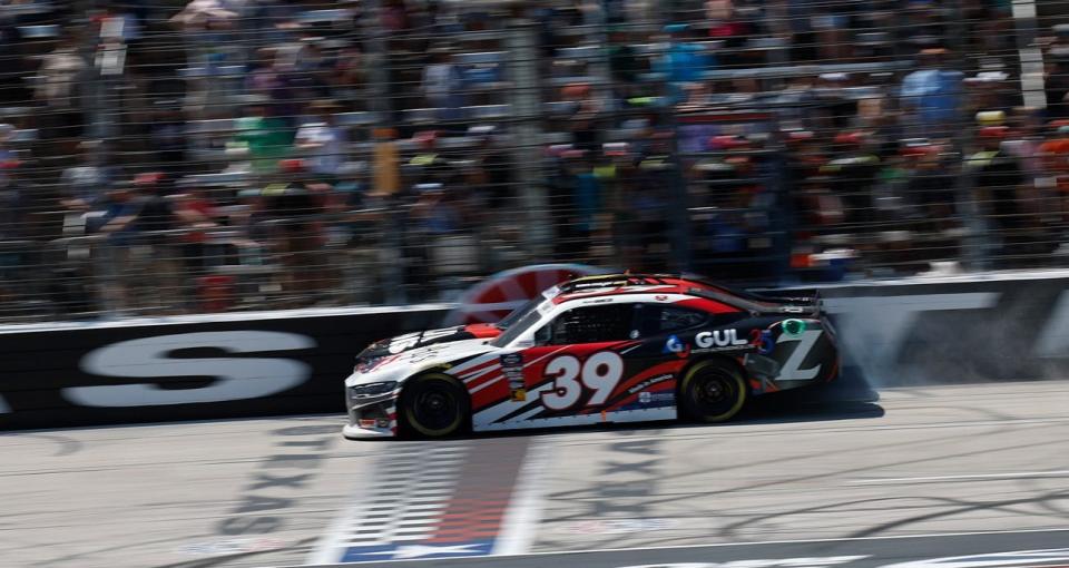 Ryan Sieg and Sam Mayer cross the start/finish line nearly simultaneously in a photo finish in the NASCAR Xfinity Series race at Texas. Mayer won.