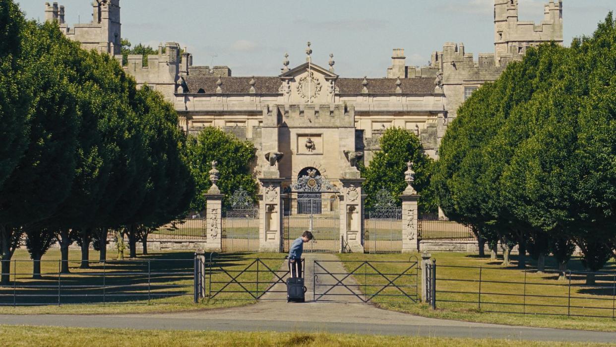 a person standing in front of a large building