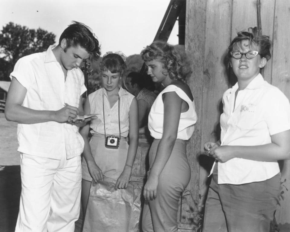 Elvis Presley on the set of "Love Me Tender in August 1956 at the 20th Century Fox Ranch, Malibu Creek State Park, California