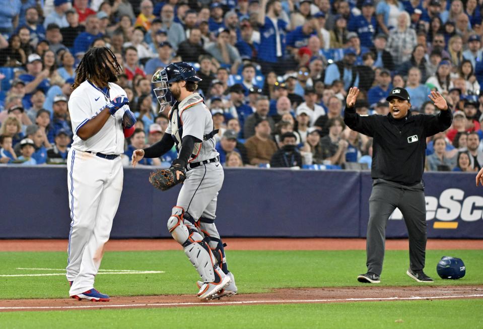Toronto Blue Jays first baseman Vladimir Guerrero Jr. (27) is ruled safe because of nterference and allowed to score after initially being tagged out by Detroit Tigers catcher Eric Haase (13) in the fourth inning at Rogers Centre in Toronto on Wednesday, April 12, 2023.
