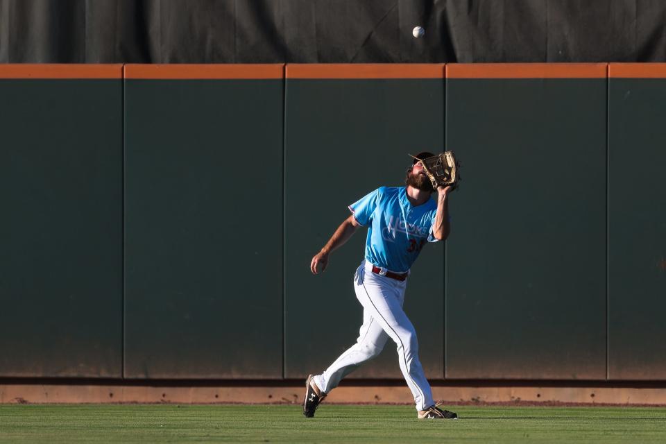 Hooks outfielder Justin Dirden (33) catches a fly ball in a game against Midland on Thursday, July 7, 2022 at Whataburger Field in Corpus Christi, Texas.