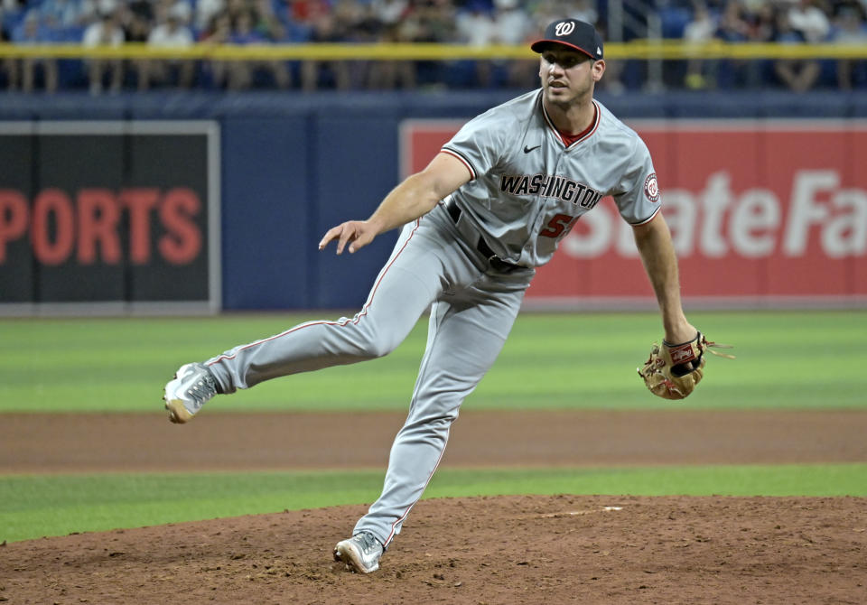 Washington Nationals reliever Jacob Barnes watches a throw to a Tampa Bay Rays batter during the sixth inning of a baseball game Friday, June 28, 2024, in St. Petersburg, Fla. (AP Photo/Steve Nesius)