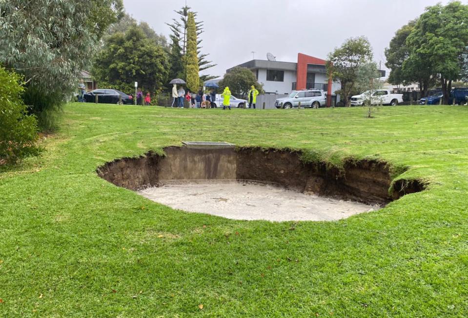 A sinkhole is pictured in parkland in Melbourne's suburb of Kew.