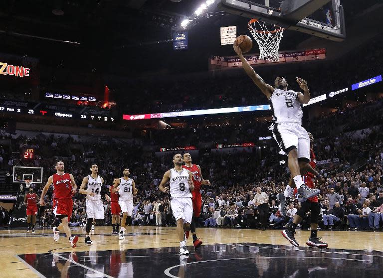 Kawhi Leonard of the San Antonio Spurs slam dunks against the Los Angeles Clippers during Game Three of the Western Conference quarterfinals of the 2015 NBA Playoffs at the AT&T Center on April 24, 2015 in San Antonio, Texas