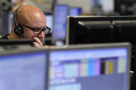 A trader monitors the screen on a trading floor in London January 22, 2010. REUTERS/Stefan Wermuth