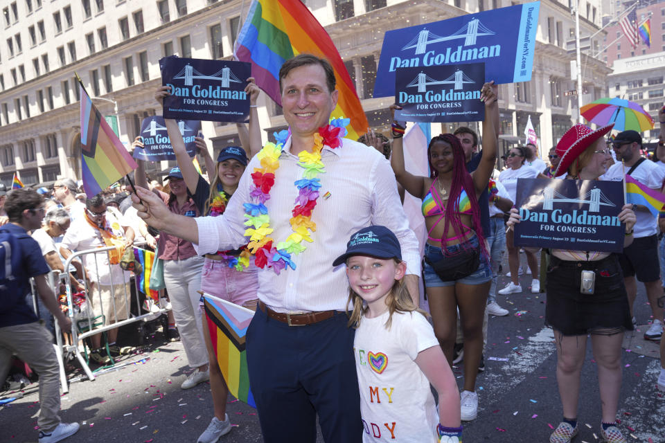 Dan Goldman wearing a lei, at the New York City Pride Parade.