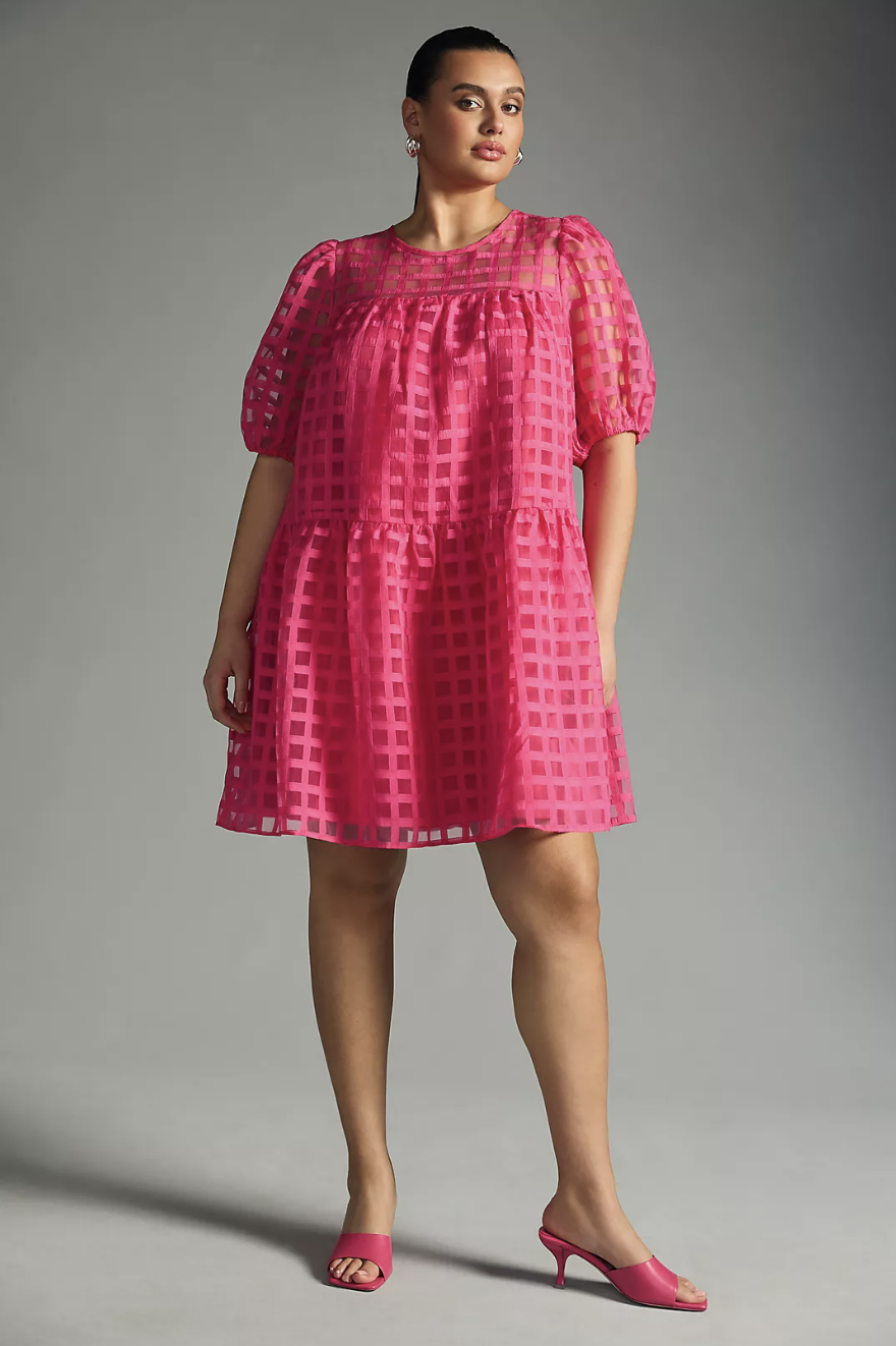 plus size model wearing pink mini dress, English Factory Plus Short-Sleeve Mini Dress (photo via Anthropologie)