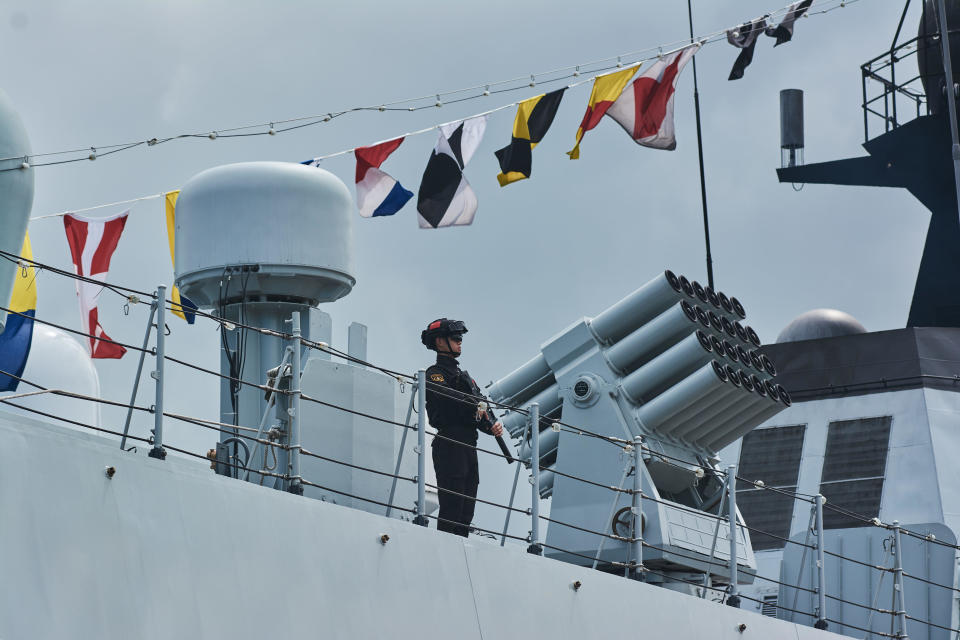 A soldier patrols onboard the Chinese frigate Rizhao 598, ahead of naval drills between Russia, South Africa and China, in Richards Bay, South Africa, Feb. 22, 2023. / Credit: Waldo Swiegers/Bloomberg/Getty