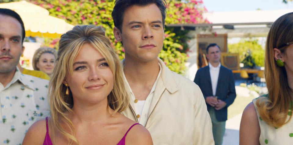 Florence Pugh and Harry Styles look off screen