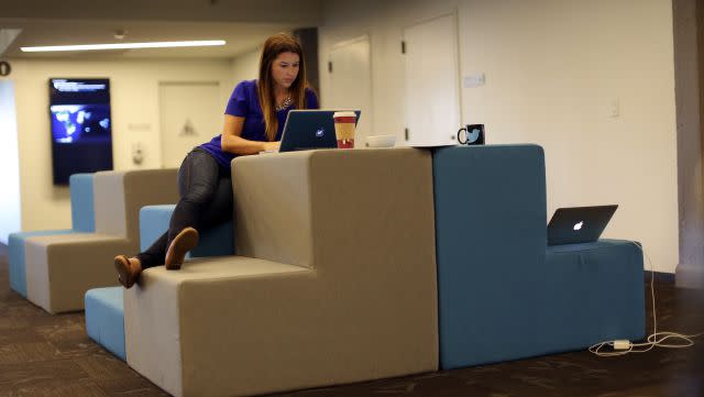 Twitter employee Amber Costa works on a computer at Twitter headquarters in San Francisco