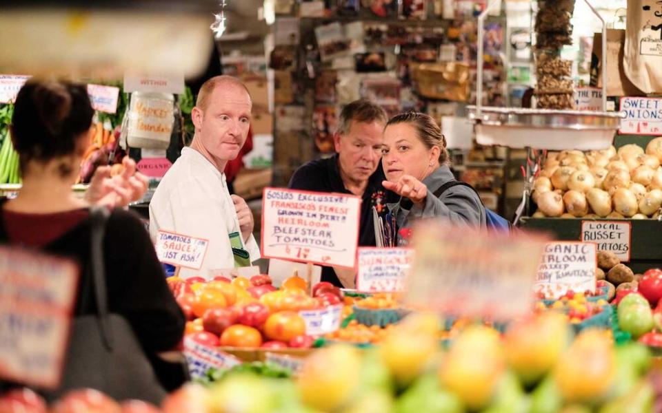 Chef Duskie Estes, right, shops at Seattle's Pike Place Market. | Courtesy of Windstar