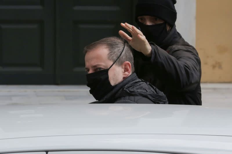 Greek actor and former director of Greece's National Theatre Lignadis enters a car as he leaves prosecutor's office, in Athens