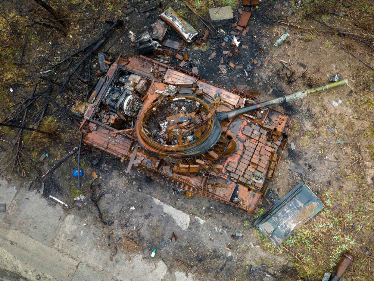 As seen from an aerial view, a destroyed Russian T-80 tank, its turret blown upside down, sits on a former frontline on February 27, 2023 in Bogorodychne, in the Donbas region of eastern Ukraine.