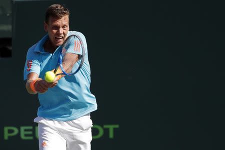 Mar 30, 2017; Miami, FL, USA; Tomas Berdych of the Czech Republic hits a backhand against Roger Federer of Switzerland (not pictured) in a men's singles quarter-final during the 2017 Miami Open at Crandon Park Tennis Center. Federer won 6-2, 3-6, 7-6(6). Mandatory Credit: Geoff Burke-USA TODAY Sports