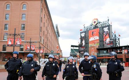 Baltimore police officers stand outside the stadium prior to the cancellation of the game between the Chicago White Sox and Baltimore Orioles at Oriole Park at Camden Yards, April 27, 2015. Mandatory Credit: Evan Habeeb-USA TODAY Sports