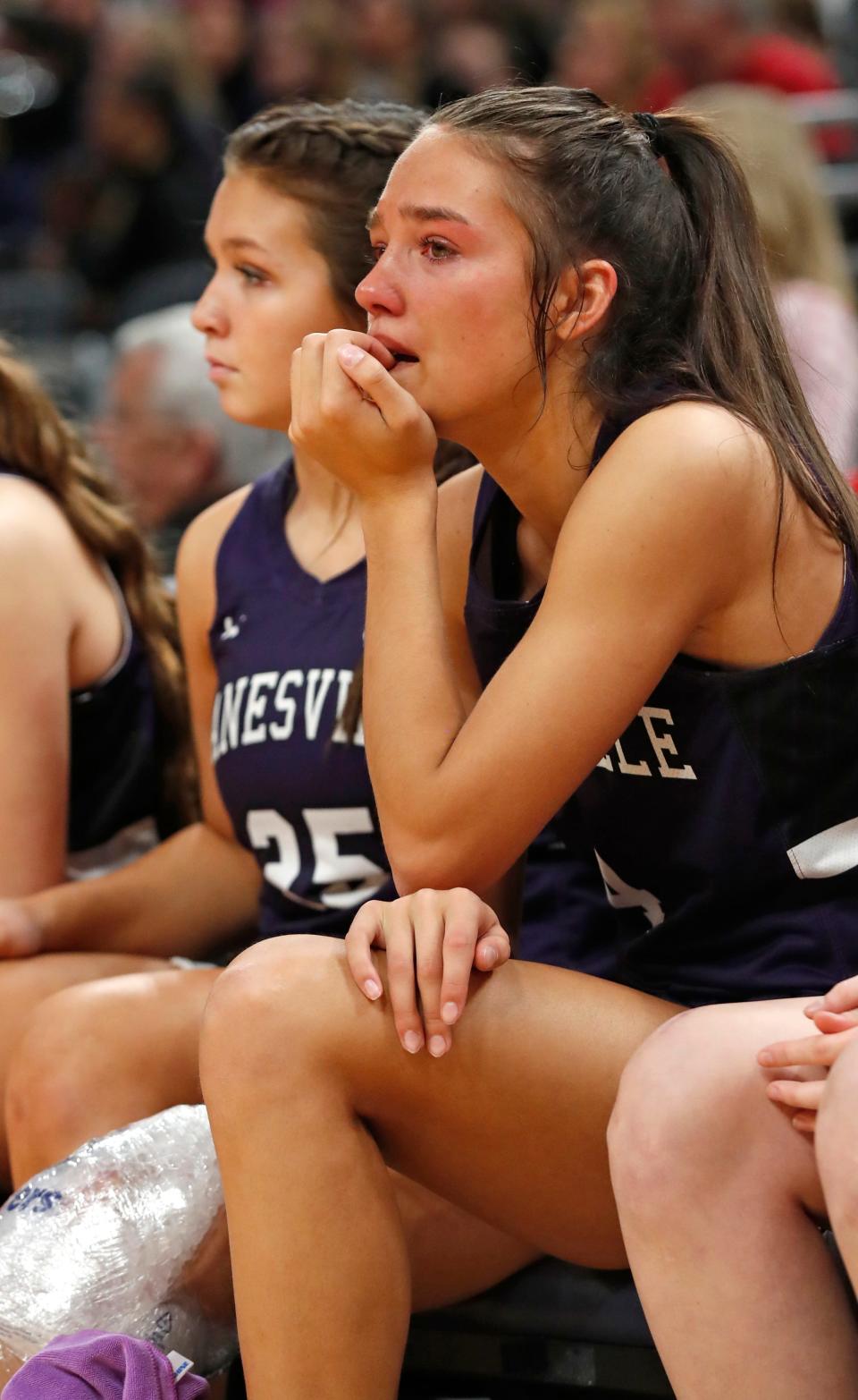 Lanesville Eagles guard Hadley Crosier (4) ices her knee during the IHSAA girls basketball Class 1A state championship against the Marquette Blazers, Saturday, Feb. 24, 2024, at Gainbridge Fieldhouse in Indianapolis. Lanesville Eagles won 51-43.