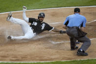 Chicago White Sox's Leury Garcia scores on a wild pitch from Tampa Bay Rays starting pitcher Tyler Glasnow as home plate umpire Ryan Blakney watches during the third inning of a baseball game Monday, June 14, 2021, in Chicago. (AP Photo/Charles Rex Arbogast)