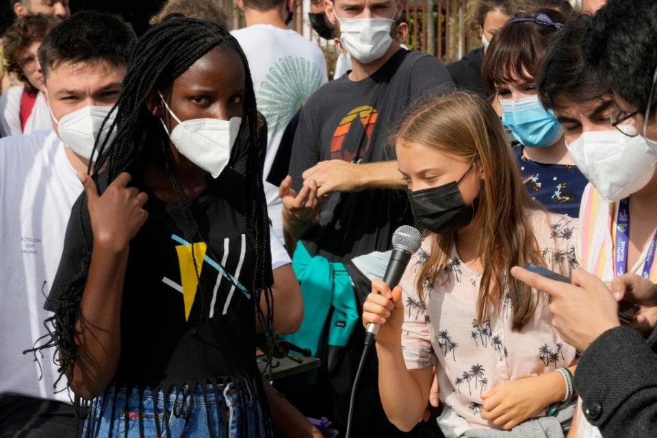 Vanessa Nakate with Greta Thunberg at a youth climate summit in Italy (AP)