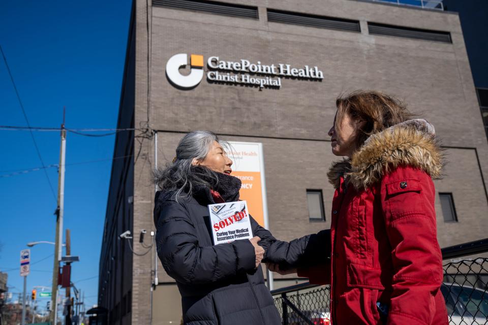 Feb 16, 2024; Jersey City, NJ, United States; Seiko Bando and Adria Goldman Gross meet in person for the first time in front of Christ Hospital. Bando left the hospital with a nearly $225,000 bill after receiving a pacemaker and spending two nights at the facility in 2016. Gross, the President and CEO of MedWise Insurance Advocacy, has been working with Bando to reduce the bill. Only hours ago, Gross and Bando received word that the bill is being waived.
