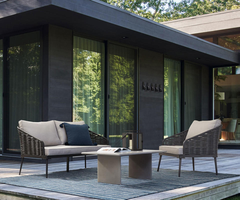 Corvo Outdoor Lounge Chair and sofa from West Elm on a deck