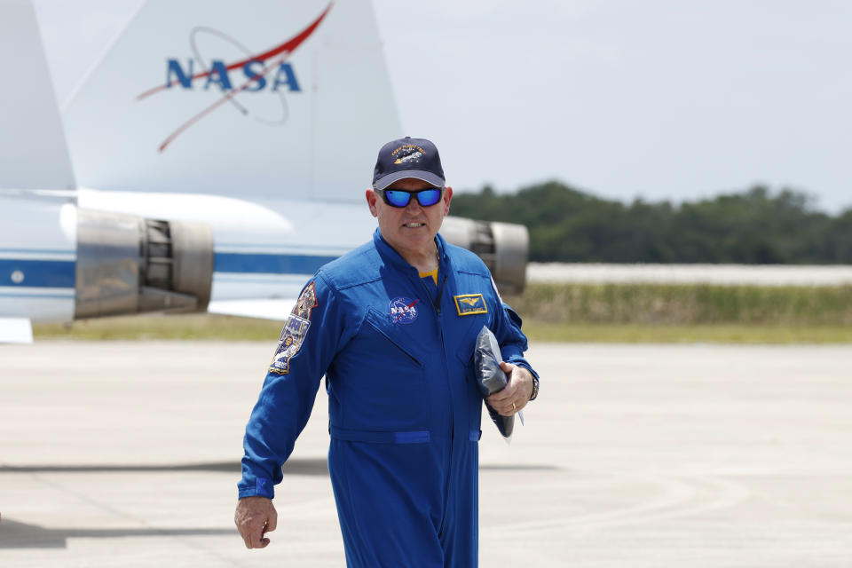 NASA astronaut Butch Wilmore, walks past NASA jets after he arrived at the Kennedy Space Center, Thursday, April 25, 2024, in Cape Canaveral, Fla. The crew of two test pilots will launch aboard Boeing's Starliner capsule atop an Atlas rocket to the International Space Station, scheduled for liftoff on May 6, 2024. (AP Photo/Terry Renna)