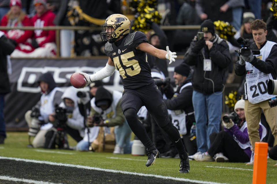 Purdue running back Devin Mockobee (45) celebrates after a touchdown during the second half of an NCAA college football game against Indiana in West Lafayette, Ind., Saturday, Nov. 25, 2023. Purdue defeated Indiana 35-31. (AP Photo/Michael Conroy)