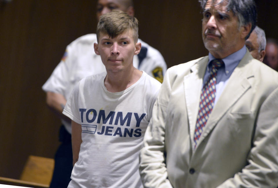 FILE - In this June 24, 2019 file photo, Volodymyr Zhukovskyy, 23, of West Springfield, and the driver of a pickup truck in a fiery collision on a rural New Hampshire highway that killed seven motorcyclists, stands with his attorney Donald Frank during his arraignment in Springfield District Court in Springfield, Mass. In a preliminary report released Wednesday, July 24, 2019, the National Transportation Safety Board summarized the details behind the June 21 crash in which a pickup truck driven by Zhukovskyy crashed into the bikers in Randolph, N.H. The report affirms early reports that Zhukovskyy crossed the center of the road and collided with the bikers. (Don Treeger/The Republican via AP, Pool, File)