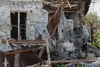 A view shows a damaged building in Mariupol