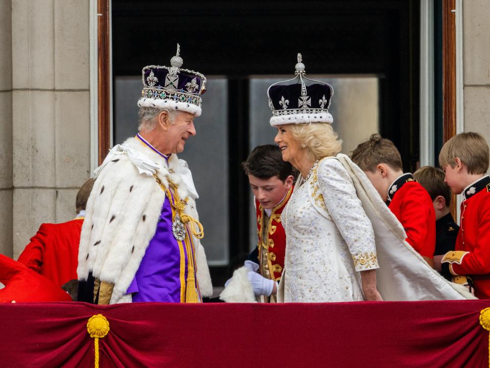 King Charles III and Queen Camilla stand on the Buckingham Palace balcony during the Coronation of King Charles III and Queen Camilla on May 6, 2023.