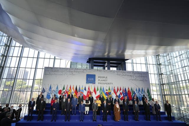 World leaders pose for a group photo at the La Nuvola conference centre during the G20 summit in Rome, Italy