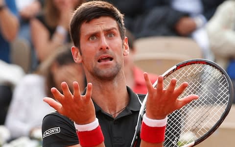Serbia's Novak Djokovic reacts after missing a shot against Italy's Marco Cecchinato in the tie break of the fourth set of their quarterfinal match at the French Open tennis tournament at the Roland Garros stadium in Paris, France, Tuesday, June 5, 2018 - Credit: AP
