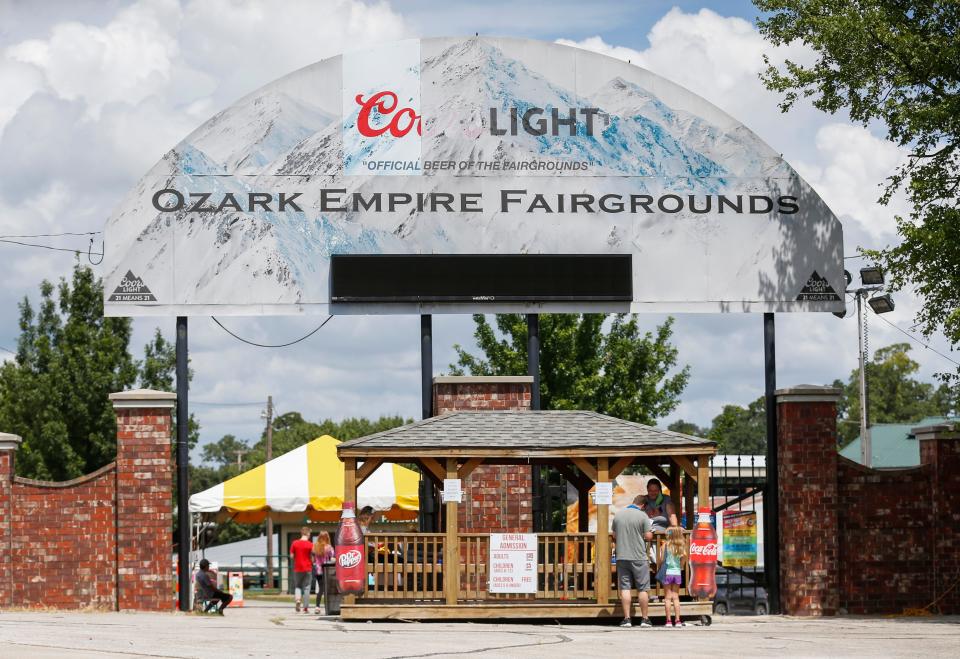 People enter the Ozark Empire Fairgrounds on Saturday, Aug. 1, 2020.