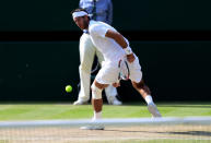 Argentina's Juan Martin Del Potro plays a shot through his legs during his match against Serbia's Novak Djokovic during day eleven of the Wimbledon Championships at The All England Lawn Tennis and Croquet Club, Wimbledon.