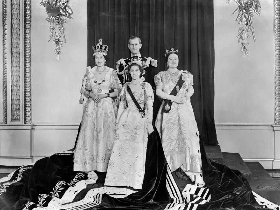 Queen Elizabeth II, left, at Buckingham Palace after her Coronation at Westminster Abbey. With her are the Duke of Edinburgh, back, Princess Margaret, front, and the Queen Mother, right.