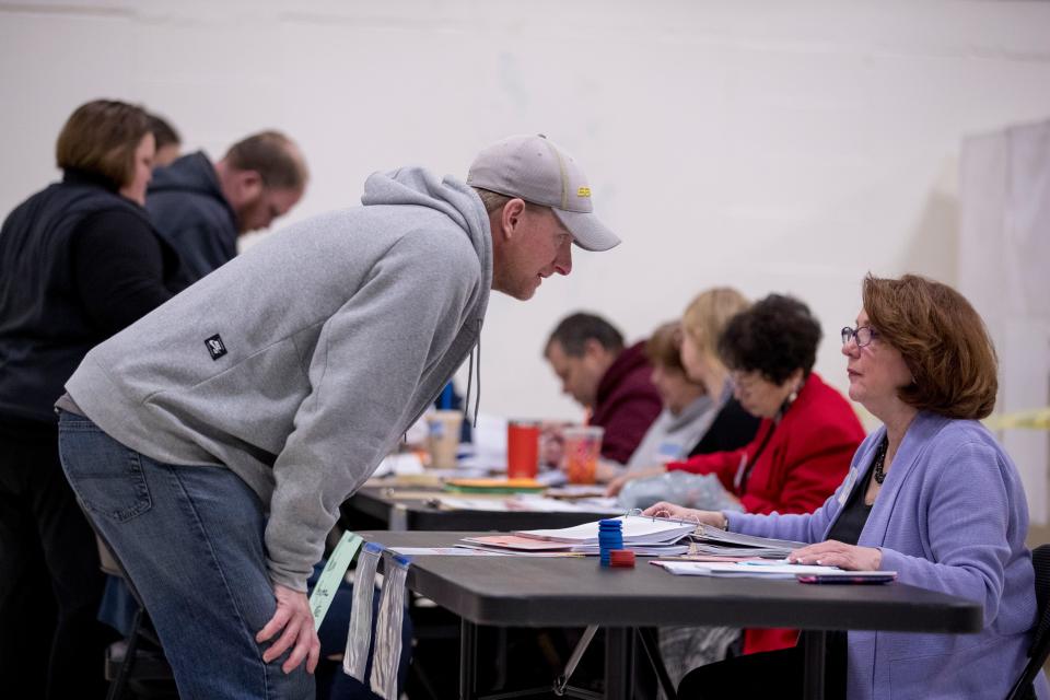 A man arrives to vote in the New Hampshire Primary at Parker-Varney Elementary Schoo on in Manchester, N.H. 