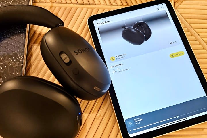 Sonos Ace beside Apple iPad running the Sonos app.