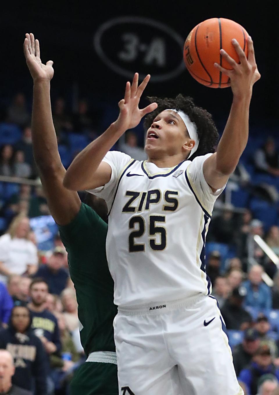 Akron's Enrique Freeman goes to the basket against Eastern Michigan Univeristy during their MAC game at the University of Akron's James A. Rhodes Arena on Friday. The Zips beat the Eagles 104 to 67.