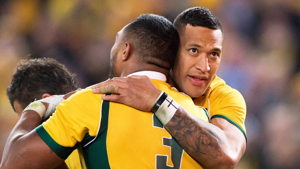 Israel Folau hugs and celebrates with Sekope Kepu for the Wallabies.